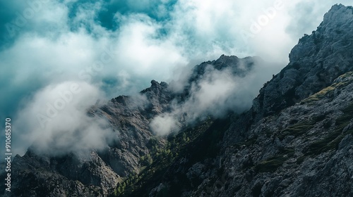 Mountain cloudsMountainsCloudsMountain landscapeScenic viewNatureWildernessNatural beautyOutdoor adventureHiking sceneryMountain peaksCloudy skyMisty mountains : Generative AI photo