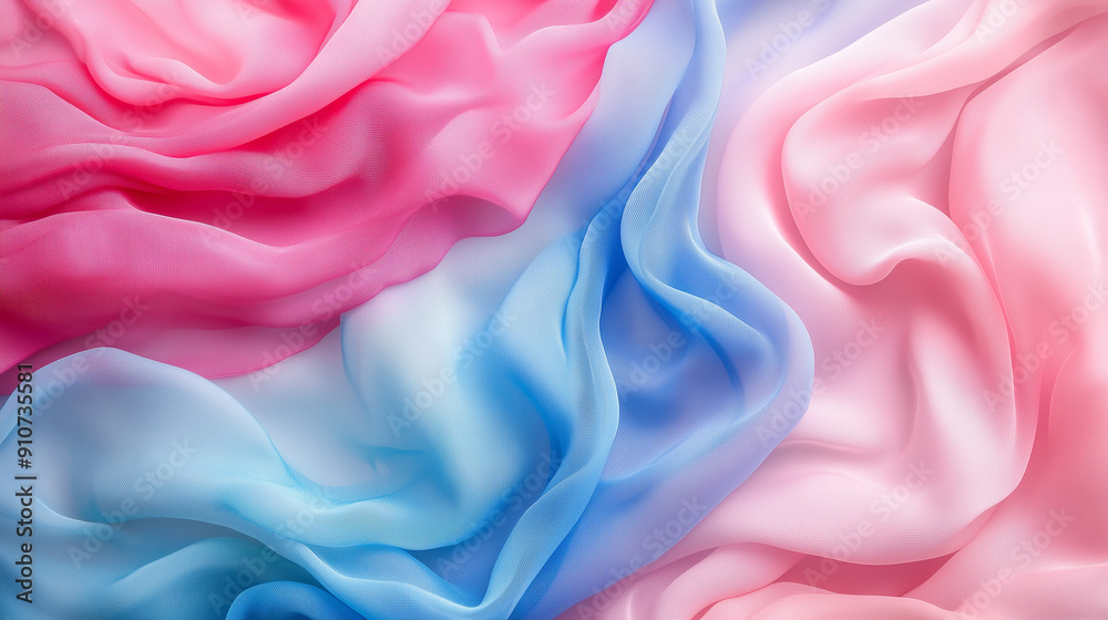 Fototapeta premium Flowing fabric in pink and blue. Soft waves of pink and blue fabric create a soothing, dreamlike texture. The gentle folds and serene colors suggest calmness and tranquility.