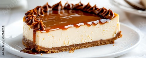 Salted caramel cheesecake with a caramel drizzle, isolated on white, sweet and salty photo