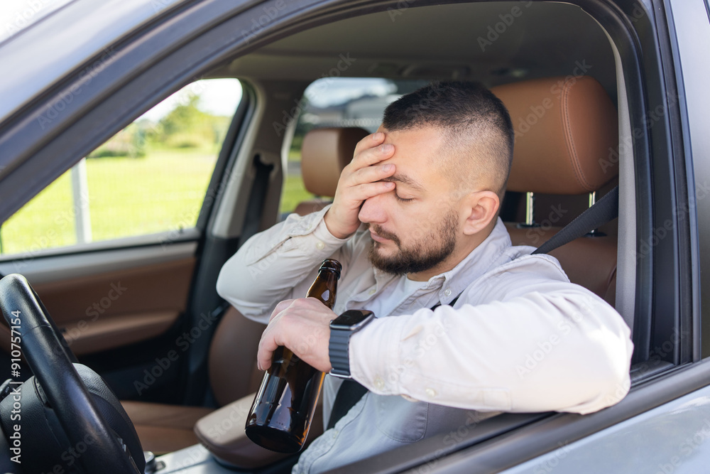 man drinking alcohol while driving the car. Don't drink and drive concept. . High quality photo man drinking alcohol while driving the car. Don't drink and drive concept. . High quality photo
