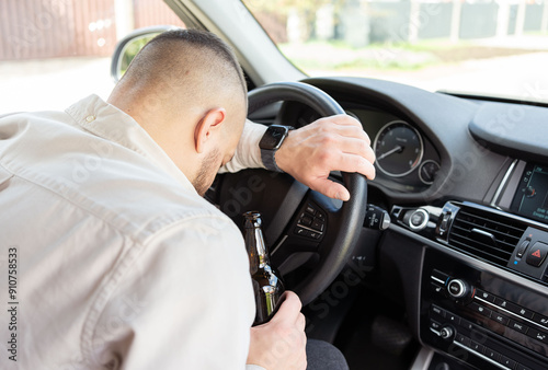 man drinking alcohol while driving the car. Don't drink and drive concept. . High quality photo