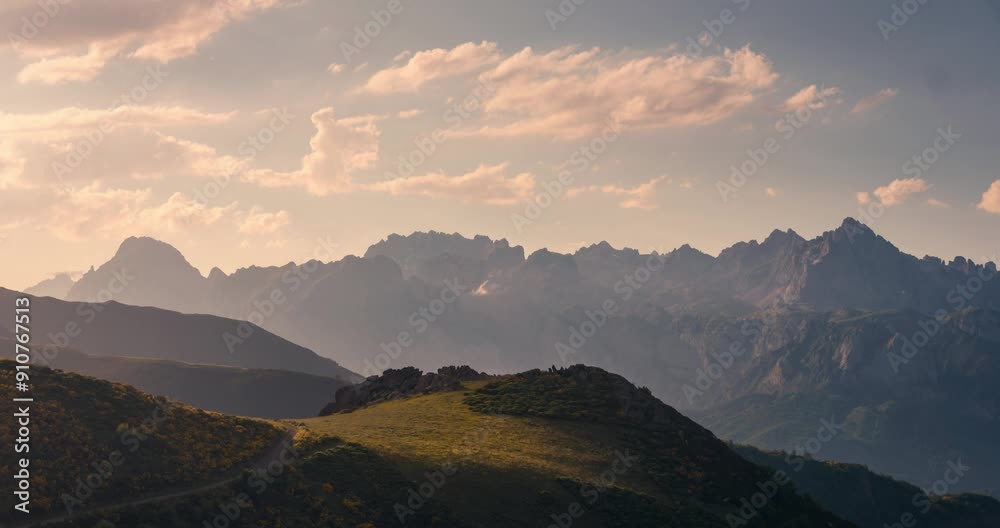View of Picos de Europa Mountain Range with beautifull golden light rays during sunset view from collado de Llesba in Northern Spain, Cantabria.