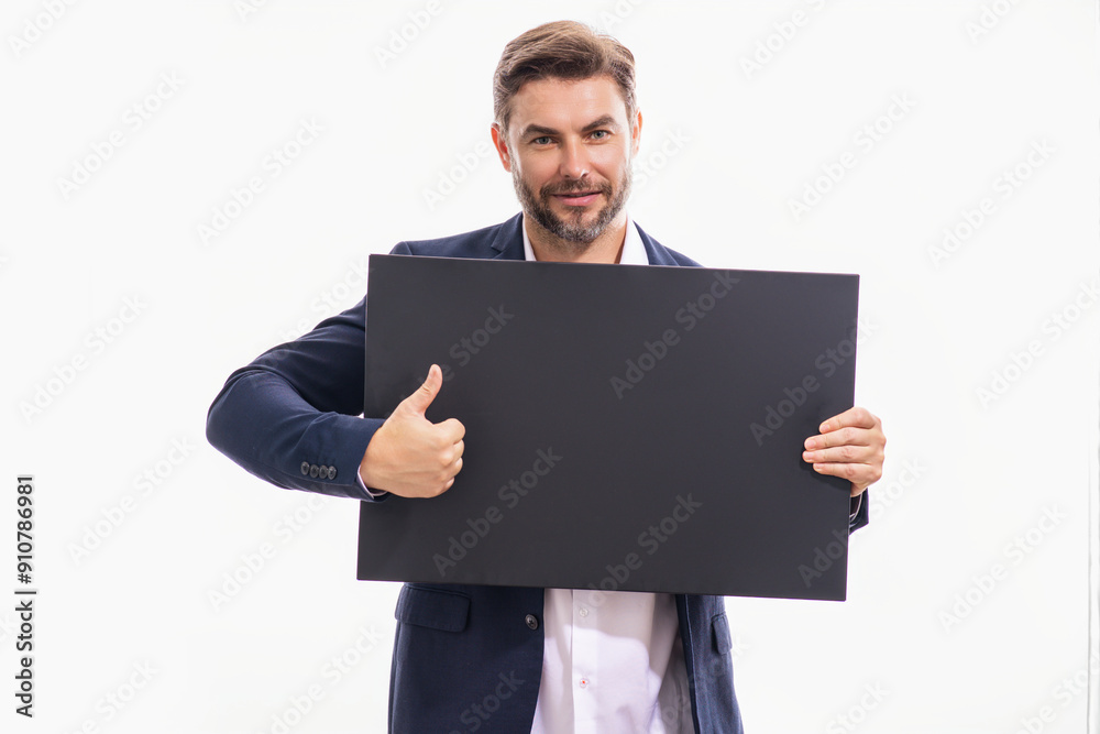 Business man in suit showing thumbs up holding promo blank board on studio background. Blank signboard with copyspace. Advertisement concept. Ad board with copy space, blank mockup. Blank signboard. Business man in suit showing thumbs up holding promo blank board on studio background. Blank signboard with copyspace. Advertisement concept. Ad board with copy space, blank mockup. Blank signboard.
