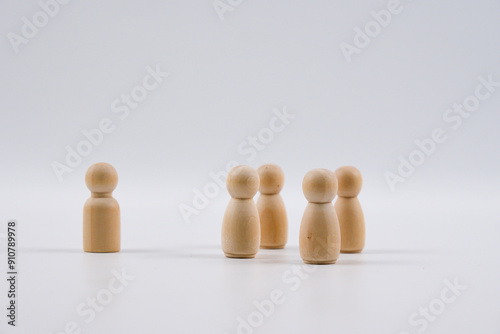 One wooden figure male and four wooden figure female. Leadership conceptual.
