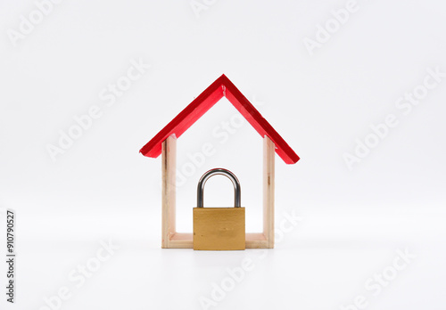 A wooden house and padlock. Isolated with white background.