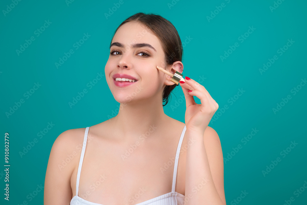 Dropping serum collagen moisturizer. Beauty woman dripping moisturizing serum from pipette on face during beauty procedure in studio. Serum Protector skin. Facial Treatment serum oil. Beauty and spa.