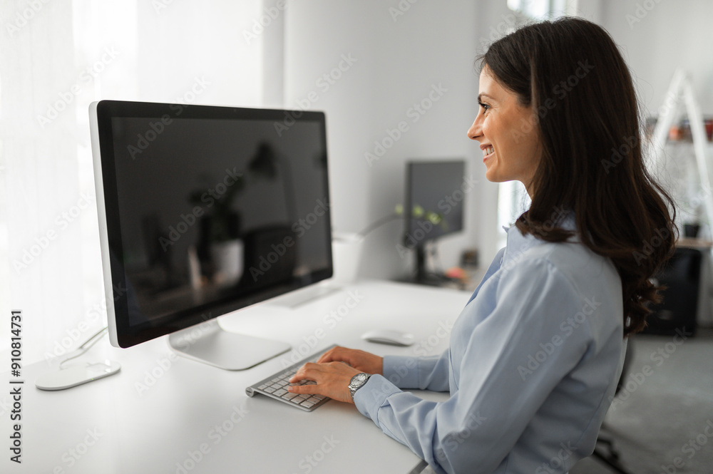 Business woman working on computer with mockup screen Business woman working on computer with mockup screen