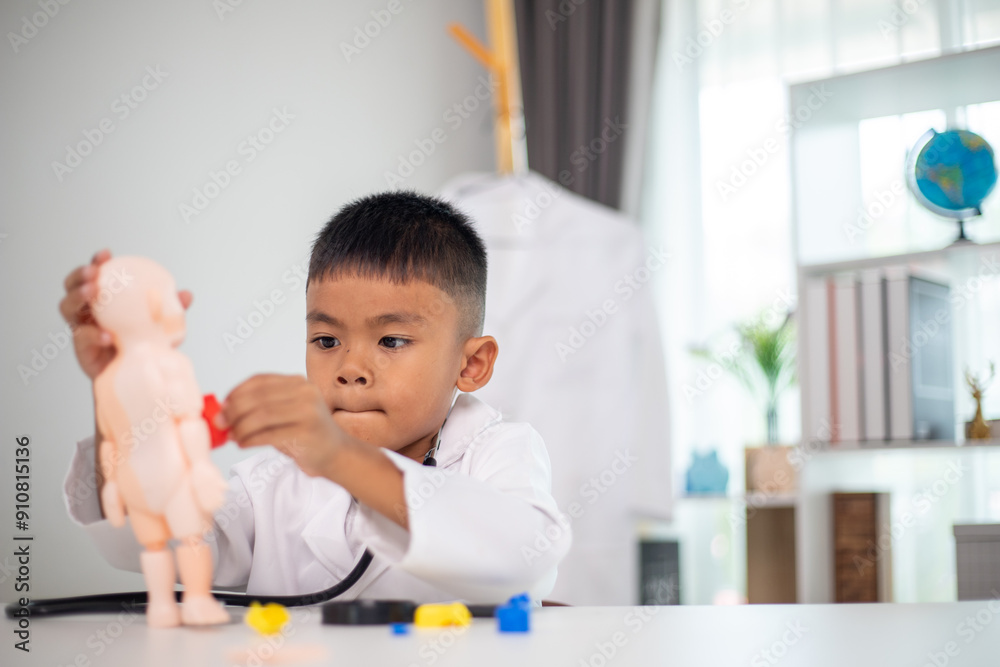 A young boy is playing with a doll in a doctor's office A young boy is playing with a doll in a doctor's office