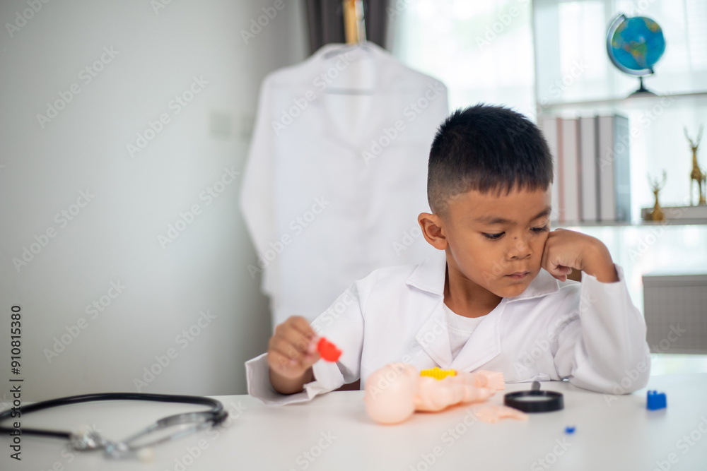A young boy is playing with a doll in a doctor's office A young boy is playing with a doll in a doctor's office