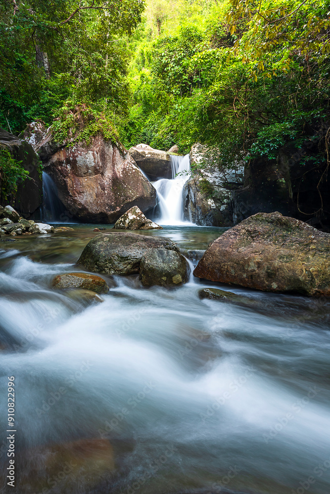 Naklejka premium Pha Kluay Mai Waterfall, 5th level in the natural forest has 8 levels of waterfalls in total. at Khao Chamao Khao Wong National Park, Rayong of Thailand