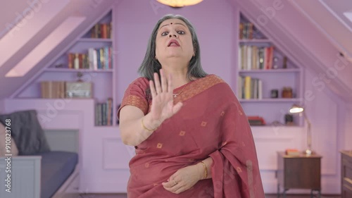 Angry Indian old woman saying No to someone