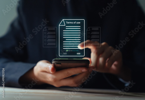 Businessman using smartphone and reading terms of service by signing to accept terms and conditions.
