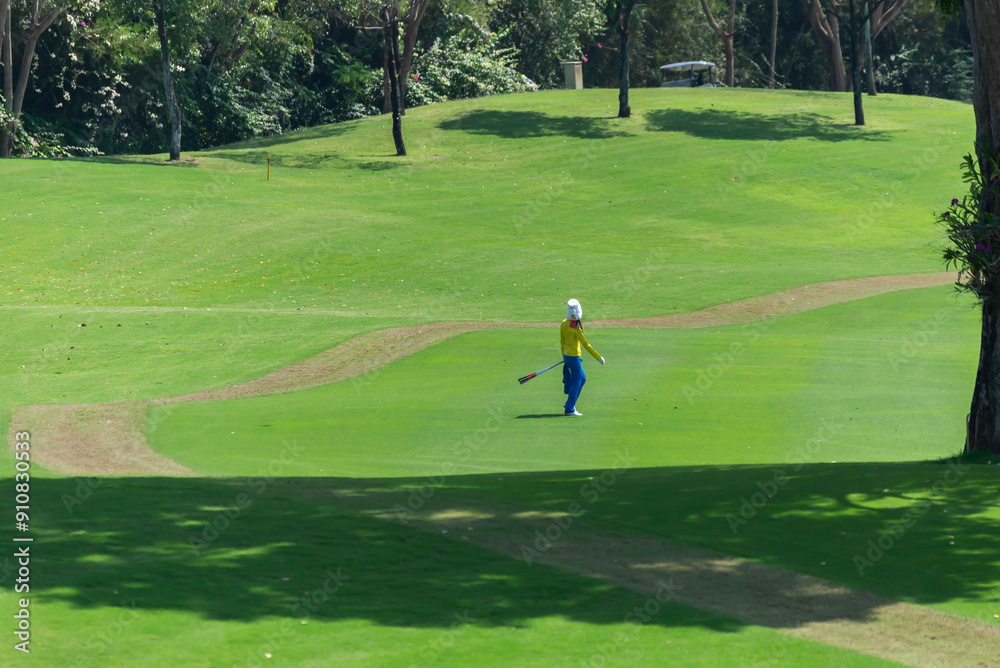 Caddy on fairway at country club golf course. lifestyle sport training golfing at golf club on summer holiday vacation. Caddy on fairway at country club golf course. lifestyle sport training golfing at golf club on summer holiday vacation.