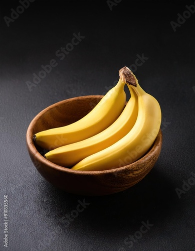  Banana in a bowl on a black background