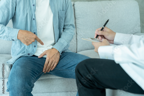 Man hold hand in front of private parts feeling discomfort and consult doctor. Venereal, testicular cancer. bladder problems, erectile dysfunction, premature ejaculation, prostate cancer