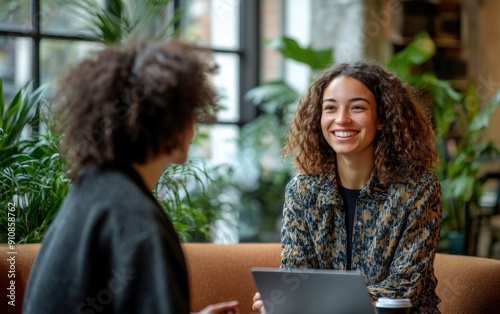 A professional mentoring session between a manager and a junior employee in a cozy office corner., 