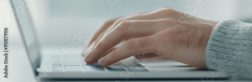 Closeup of hands typing on a computer keyboard 