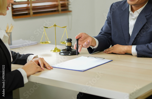 
judge on wooden table And experienced lawyers meet with clients and give advice behind the scenes. legal services legal consulting concept