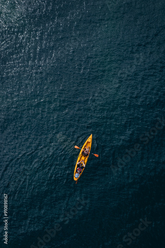 Aerial view to a people with kayak in deep blue sea