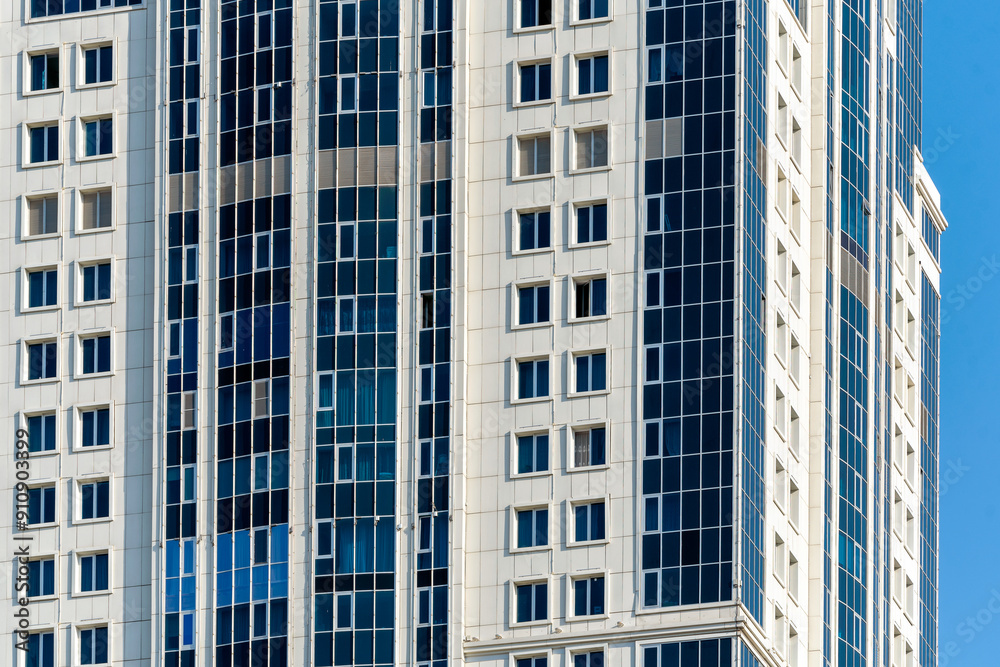 many windows and walls facade of a modern skyscraper without people many windows and walls facade of a modern skyscraper without people