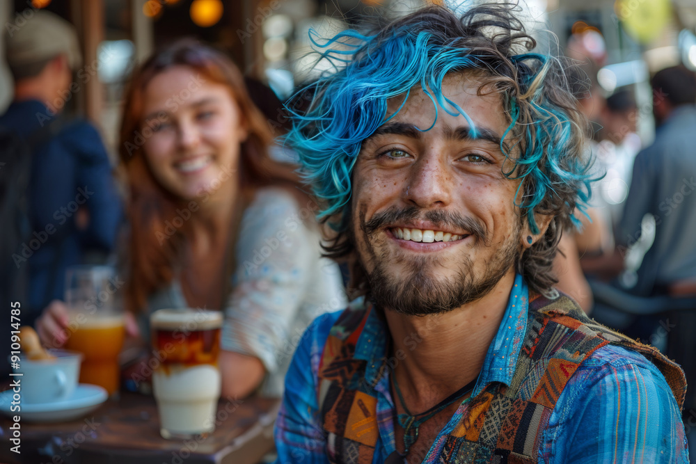Smiling young man with blue hair enjoying coffee at an outdoor cafe with a friend Smiling young man with blue hair enjoying coffee at an outdoor cafe with a friend