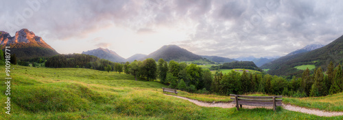 Meadow with road and bench in Berchtesgaden National Park photo