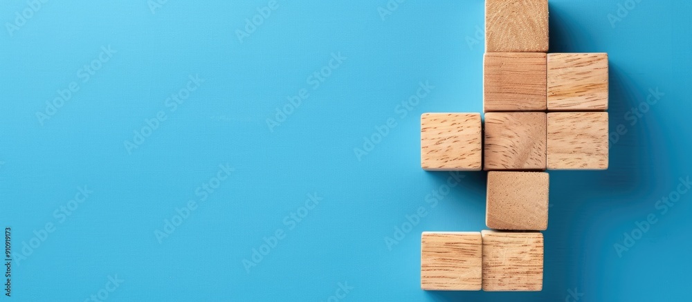 Top view of wooden cube blocks with gradient loaded word on blue background features copy space image Top view of wooden cube blocks with gradient loaded word on blue background features copy space image