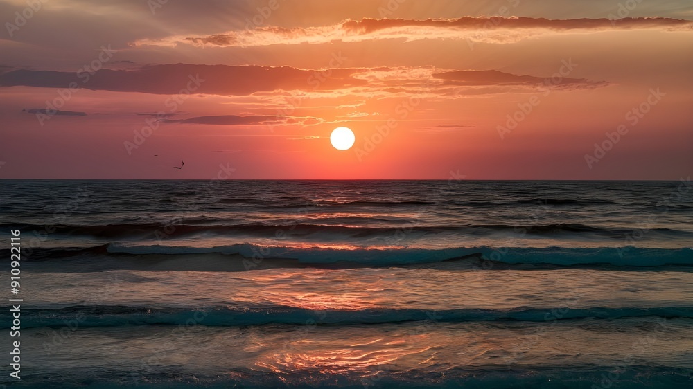 A sunset over the Sea, with vibrant sky hues of orange, pink, and deep purples. The sea reflecting these colors. A sunset over the Sea, with vibrant sky hues of orange, pink, and deep purples. The sea reflecting these colors.
