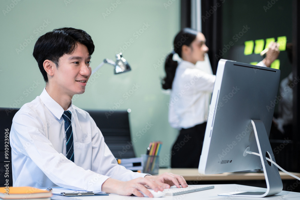 Fototapeta premium Asian employee working at office with laptop and documents on desk, People Work in Business Office.