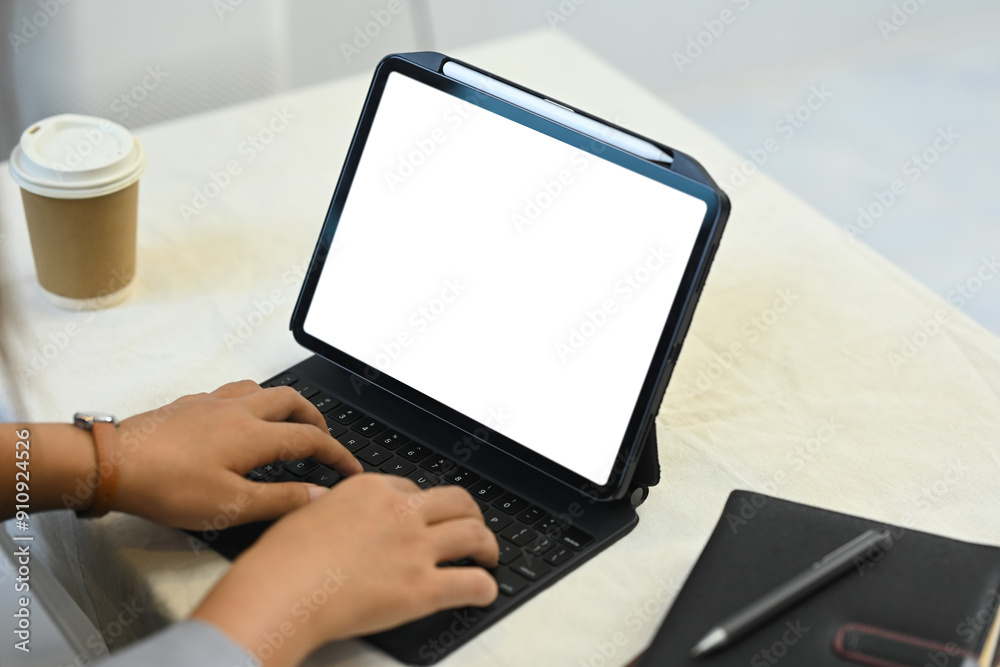 Close up image of woman hands typing on wireless keyboard of digital tablet, working at home Close up image of woman hands typing on wireless keyboard of digital tablet, working at home