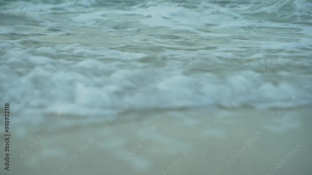 Low angle shot of surf coming towards beach. Low angle shot of surf coming towards beach.