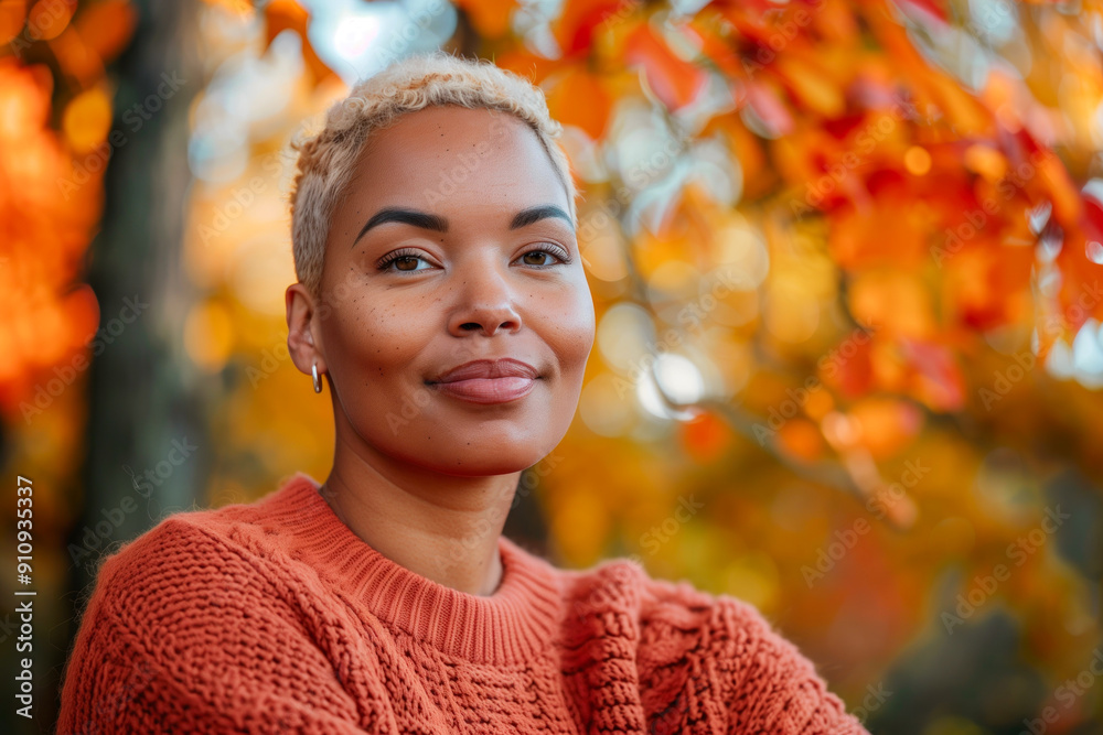 Confident woman in an orange sweater with autumn foliage background, smiling softly. Concepts of confidence, self-assurance, and the beauty of fall. Confident woman in an orange sweater with autumn foliage background, smiling softly. Concepts of confidence, self-assurance, and the beauty of fall.