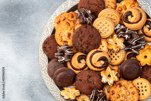 Mix of cookies . Many unhealthy snacks . Top view photo