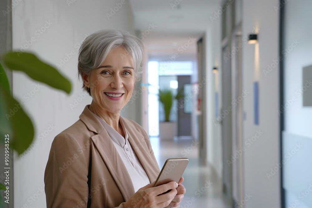 Successful Middle-Aged Business Woman Using Smartphone in Office Hallway | Professional Entrepreneur Communicating with Mobile Cellphone Successful Middle-Aged Business Woman Using Smartphone in Office Hallway | Professional Entrepreneur Communicating with Mobile Cellphone