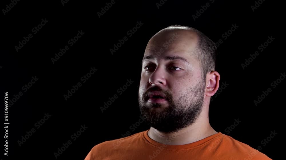 Close up interview video of a man isolated on black background. Close up interview video of a man isolated on black background.