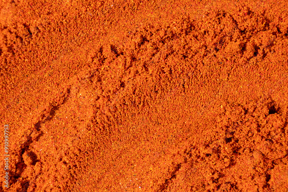 Ground paprika, red terracotta spice background, art in cooking. Ground paprika, red terracotta spice background, art in cooking.