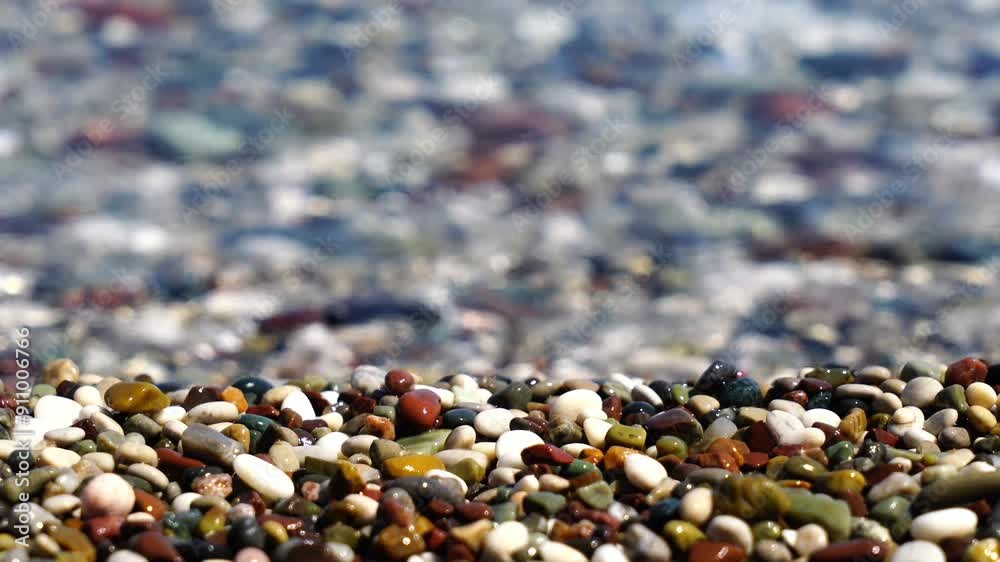 Enjoy a peaceful view of pebbles on the shore, where gentle waves lap against the smooth stones. This serene scene captures the simple beauty of nature's textures and sounds. Enjoy a peaceful view of pebbles on the shore, where gentle waves lap against the smooth stones. This serene scene captures the simple beauty of nature's textures and sounds.