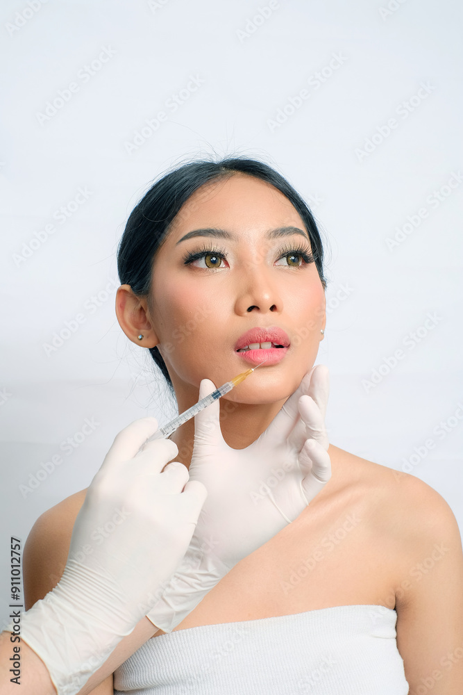 Sophisticated Asian Woman with Updo Getting Filler Injection Sophisticated Asian Woman with Updo Getting Filler Injection