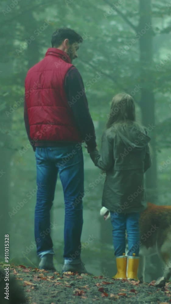 Shot back father and daughter standing in forest with dog at autumn weekend communicating enjoying nature. Relaxation travel childhood adventure outside. Slow motion Shot back father and daughter standing in forest with dog at autumn weekend communicating enjoying nature. Relaxation travel childhood adventure outside. Slow motion