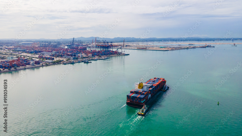 the aerial perspective of a cargo ship being loaded and unloaded at a bustling seaport and sailing out of the mainland the aerial perspective of a cargo ship being loaded and unloaded at a bustling seaport and sailing out of the mainland