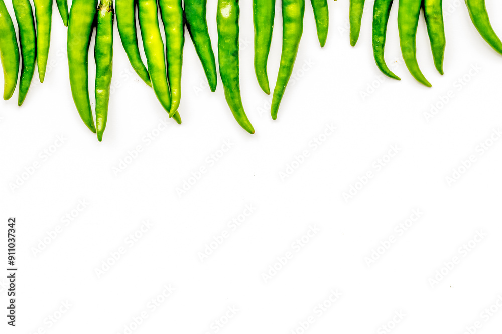 Fresh green chilli pepper as food ingredient on white table background top view mockup Fresh green chilli pepper as food ingredient on white table background top view mockup