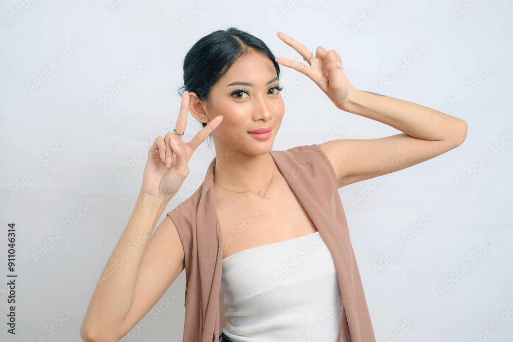 Delighted Asian Woman in Elegant Vest with White Background Delighted Asian Woman in Elegant Vest with White Background