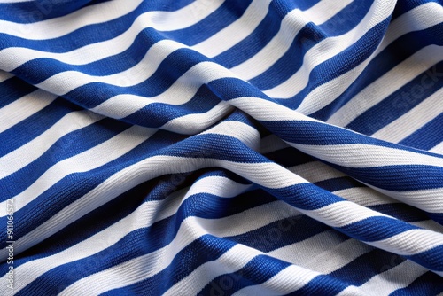 Classic nautical-inspired blue and white striped fabric features soft, stretchy knit construction, ideal for crafting durable, shape-retaining shirts, dresses, and loungewear garments. photo