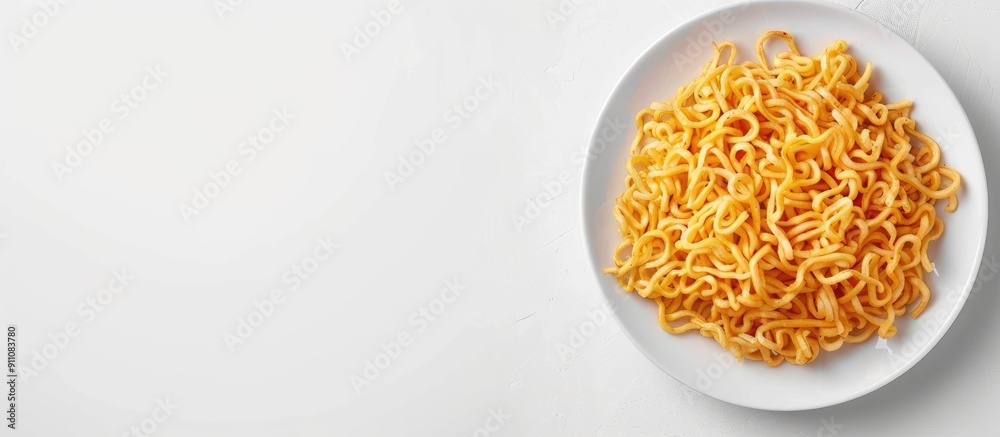 Plate with fried noodles on white surface with copy space image Plate with fried noodles on white surface with copy space image