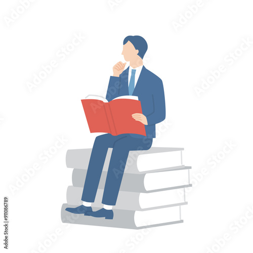 本に座って読書をするビジネスマン