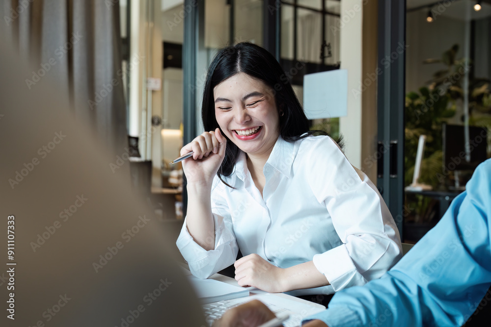Smiling Businesswoman in Modern Office Environment Engaging in a Productive Meeting with Colleagues Smiling Businesswoman in Modern Office Environment Engaging in a Productive Meeting with Colleagues