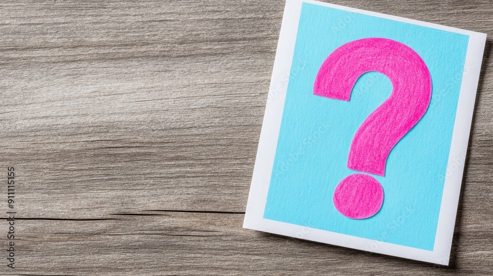Colorful Question Mark Card Placed on Wooden Surface for Creative Inquiry Colorful Question Mark Card Placed on Wooden Surface for Creative Inquiry
