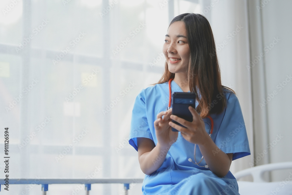 Young female doctor happily using a smartphone in a bright hospital room, showcasing the blend of healthcare and technology Young female doctor happily using a smartphone in a bright hospital room, showcasing the blend of healthcare and technology