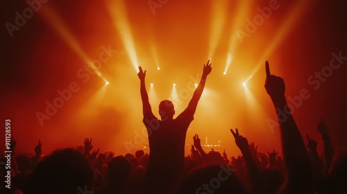 Capture the electrifying energy of a live concert with vibrant lights and enthusiastic fans. Perfect for music events, promotions, or entertainment media.