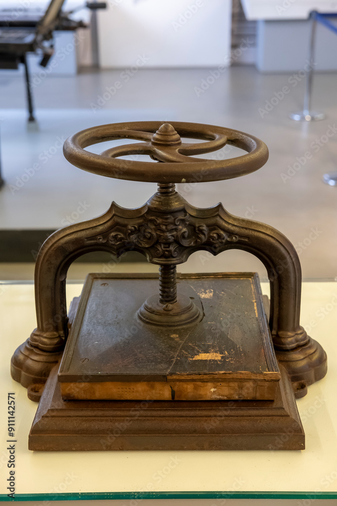 Old small portable printing press made of iron and wood Old small portable printing press made of iron and wood